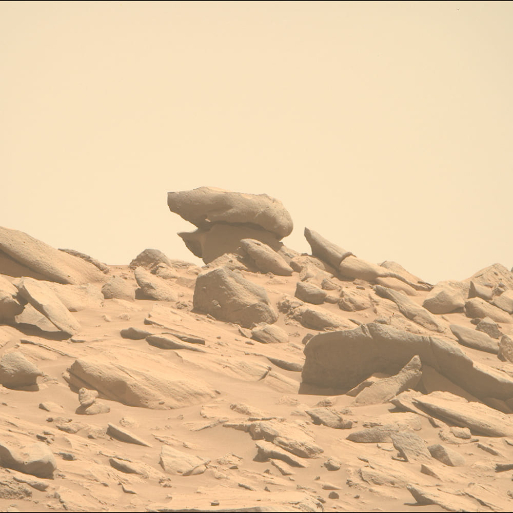 Mars - 2 Apollo Astronaut James B. Irwin, lunar module pilot, works at the Lunar Roving Vehicle during the first Apollo 15 lunar surface extravehicular activity (EVA) at the Hadley-Apennine landing site. The shadow of the Lunar Module "Falcon" is in the foreground. This view is looking northeast, with Mount Hadley in the background. This photograph was taken by astronaut David R. Scott, commander. Image Credit: NASA