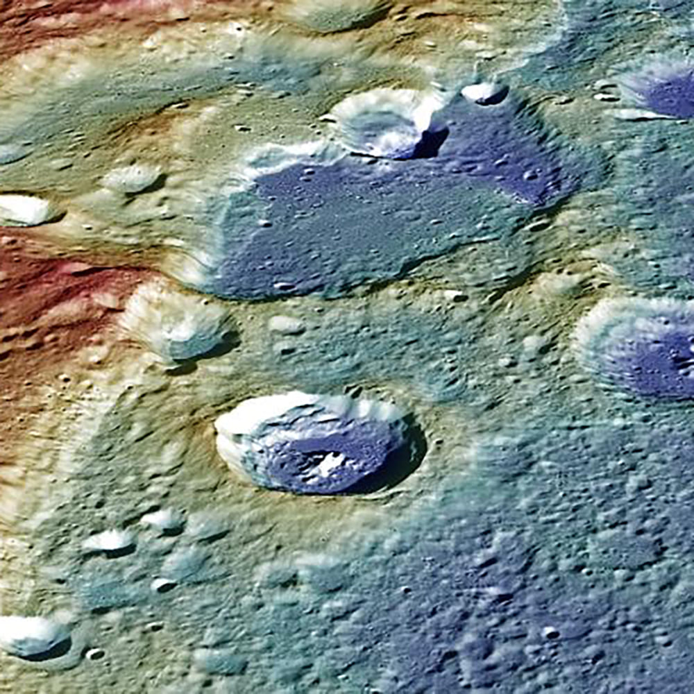 Mercury - 3 Apollo Astronaut James B. Irwin, lunar module pilot, works at the Lunar Roving Vehicle during the first Apollo 15 lunar surface extravehicular activity (EVA) at the Hadley-Apennine landing site. The shadow of the Lunar Module "Falcon" is in the foreground. This view is looking northeast, with Mount Hadley in the background. This photograph was taken by astronaut David R. Scott, commander. Image Credit: NASA